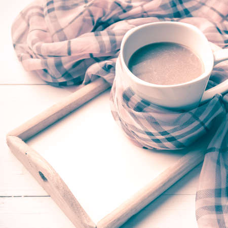 coffee and scarf background on white table vintage styleの写真素材