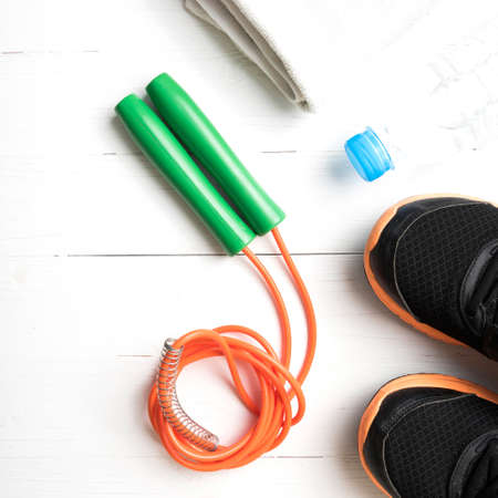 fitness equipment:running shoes,water bottle,towel,rope