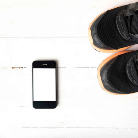 fitness equipment:running shoes,smartphoneの写真素材