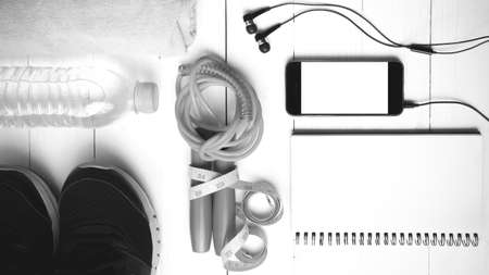 fitness equipment : running shoes,towel,jumping rope,water bottle,phone,notepad and measuring tape...