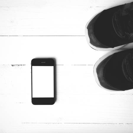 fitness equipment:running shoes,smartphone black and white color styleの写真素材