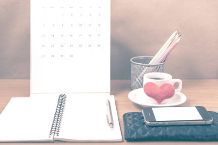 office desk : coffee with phone,wallet,calendar,heart,color pencil box,notepad,heart on wood...