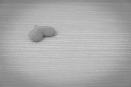 red heart on wood table background black and white colorの写真素材
