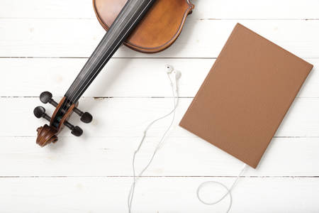 violin with notebook and earphoneの写真素材
