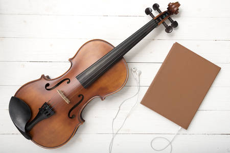 violin with notebook and earphoneの写真素材