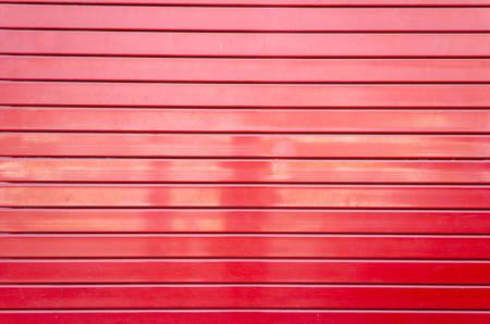 red metal security roller door backgroundの写真素材