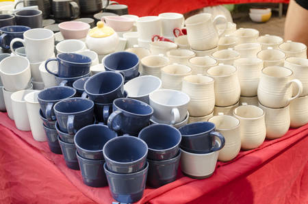 Stacked ceramic bowls and mugs ceramic products for saleのeditorial素材