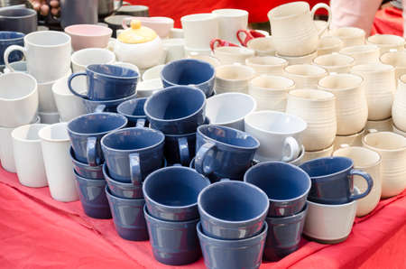 Stacked ceramic bowls and mugs ceramic products for saleの写真素材