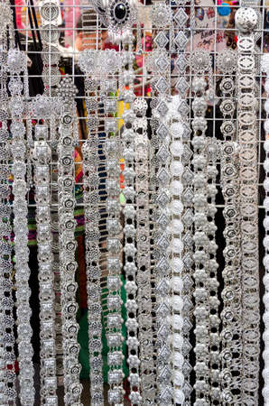 Thai handmade silver belt and accessories on the market.の写真素材