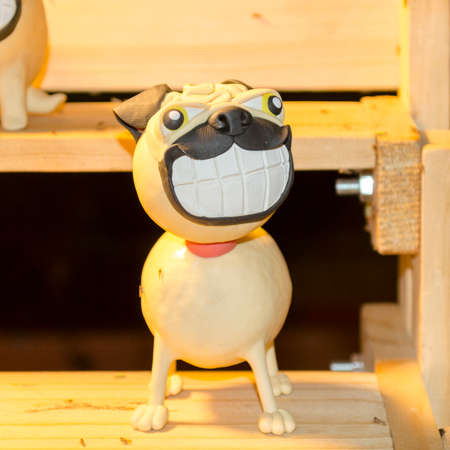 Decorative puppy/dog. Children's rooms, interior, garden decor. Ceramic statueの写真素材