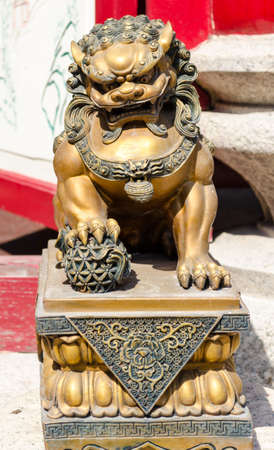 Gold Lion statue in Chinese Temple at China town,Thailandの写真素材