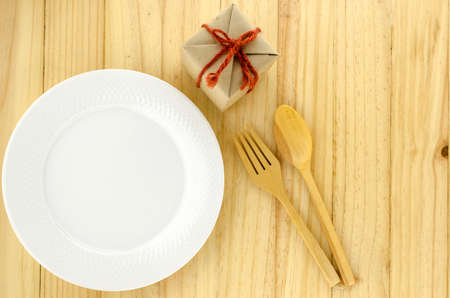 top view of craft gift box with dish on wood background concept food for giftの写真素材