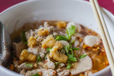 Tom yum pork noodle soup Thailand food の写真素材