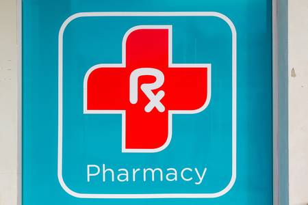 A pharmacy sign outside of a drug store.のeditorial素材