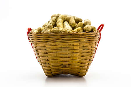 Boiled peanuts in the basket on white backgroundの写真素材