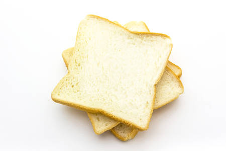 Close-up image of slice of white bread against the white backgroundの写真素材