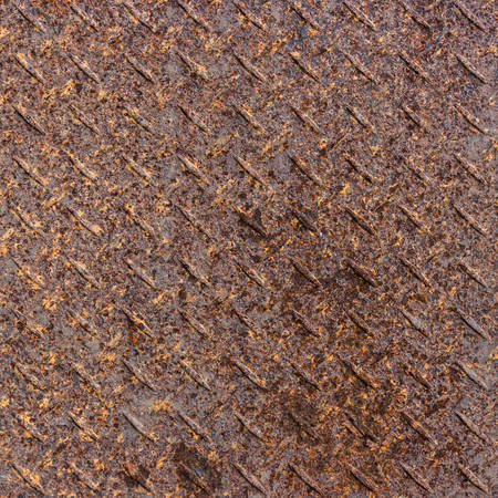 Rusty grunge diamond metal plate background. の写真素材