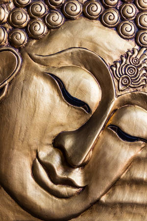 Close up Traditional Thai style Lord Buddha's face wood carving. Thailand  の写真素材