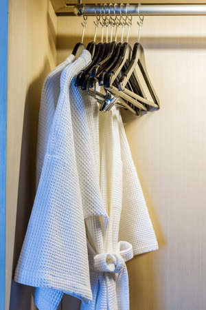 Close up of twins bathrobe in wardrobe in hotel.の写真素材
