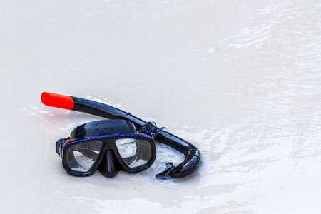 Close up mask and snorkel on tropical beach.の写真素材
