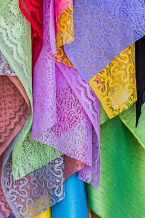 Colorful of fabric Lace rolls in shop, texture background.の写真素材