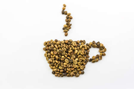 Coffee beans placed in the shape of a cup and smoke isolate white background  