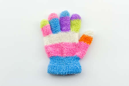 Colorful woolen glove of children, on isolated white background.の写真素材