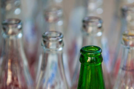 Bunch of empty green and white glass bottles.  の写真素材