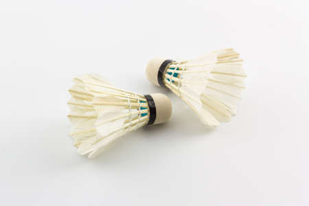 Two white shuttlecocks on white background, Badminton. 