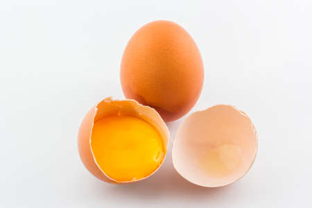 Broken egg isolated on white background. の写真素材