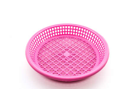 Pink plastic basket on isolated white background. の写真素材