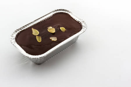 Foil box of Chocolate cake on white background.