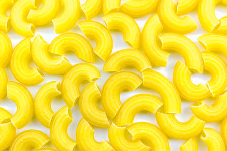 Yellow raw macaroni texture background.