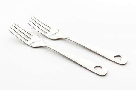 Close up of fork on white background.