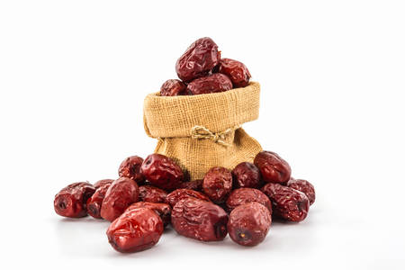 Dried Red chinese jujube on white background. の写真素材