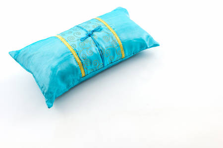 Blue pillow on white background.の写真素材