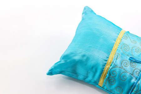 Blue pillow on white background.の写真素材