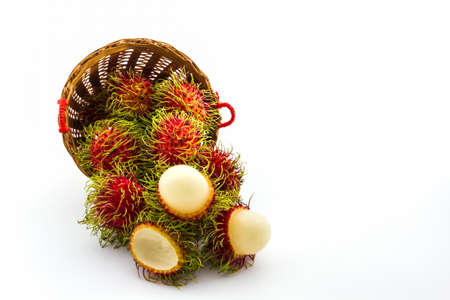 Rambutan fruit in basket on white background. の写真素材