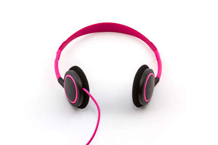 Pink headphones on white background. の写真素材