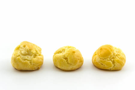 Sweet Fresh Mini Cream Puffs, Profiterole, Choux,Eclair, dessert on white background. の写真素材