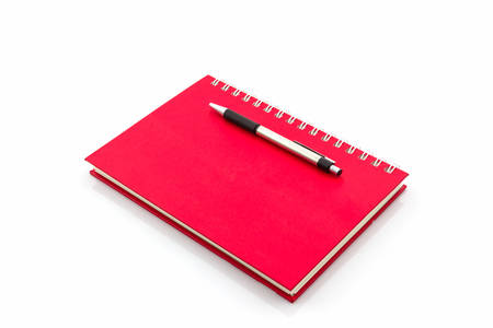 Red Diary Book with pen on white background.の写真素材