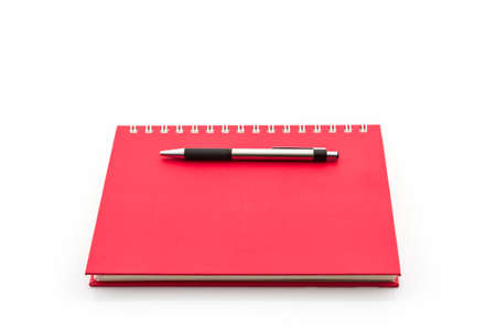 Red Diary Book with pen on white background. の写真素材