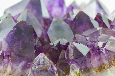 Crystal Stone, purple rough amethyst crystals on texture background.