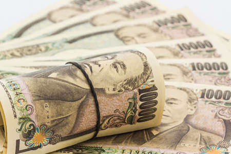 Japanese Yen banknotes on white background.の写真素材
