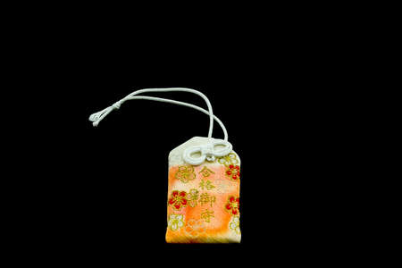 Japanese charms commonly sold at religious sites Shinto and Buddhist, provide various forms of luck or protection.の写真素材
