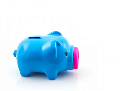 Blue piggy bank saving on white .の写真素材