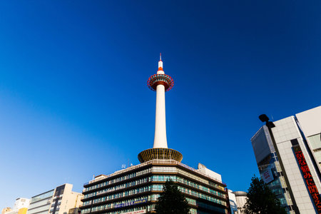 Kyoto, Japan - October 24, 2014: Kyoto tower with blue sky in Japan. The steel tower is the tallest structure in Kyoto with its spire at 131 metres (430 ft).のeditorial素材