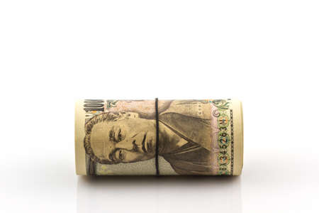Japanese Yen banknotes on white background.の写真素材