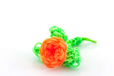 Colorful elastic rainbow loom bands on white background.の写真素材