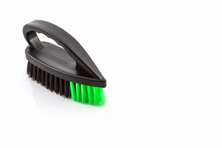 Black cleaning plastic brush on white background.の写真素材